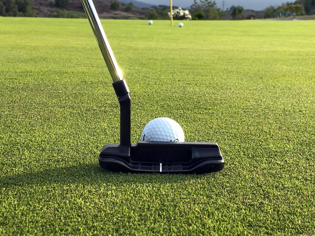 a golf ball on a putter