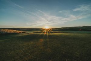 Golf course with sunset